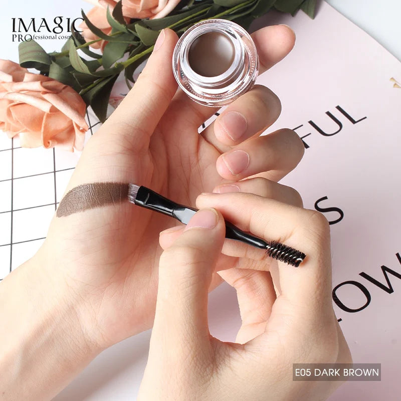 Swatch of Imagic Eyebrow Pomade E05 Dark Brown applied with angled brush on hand