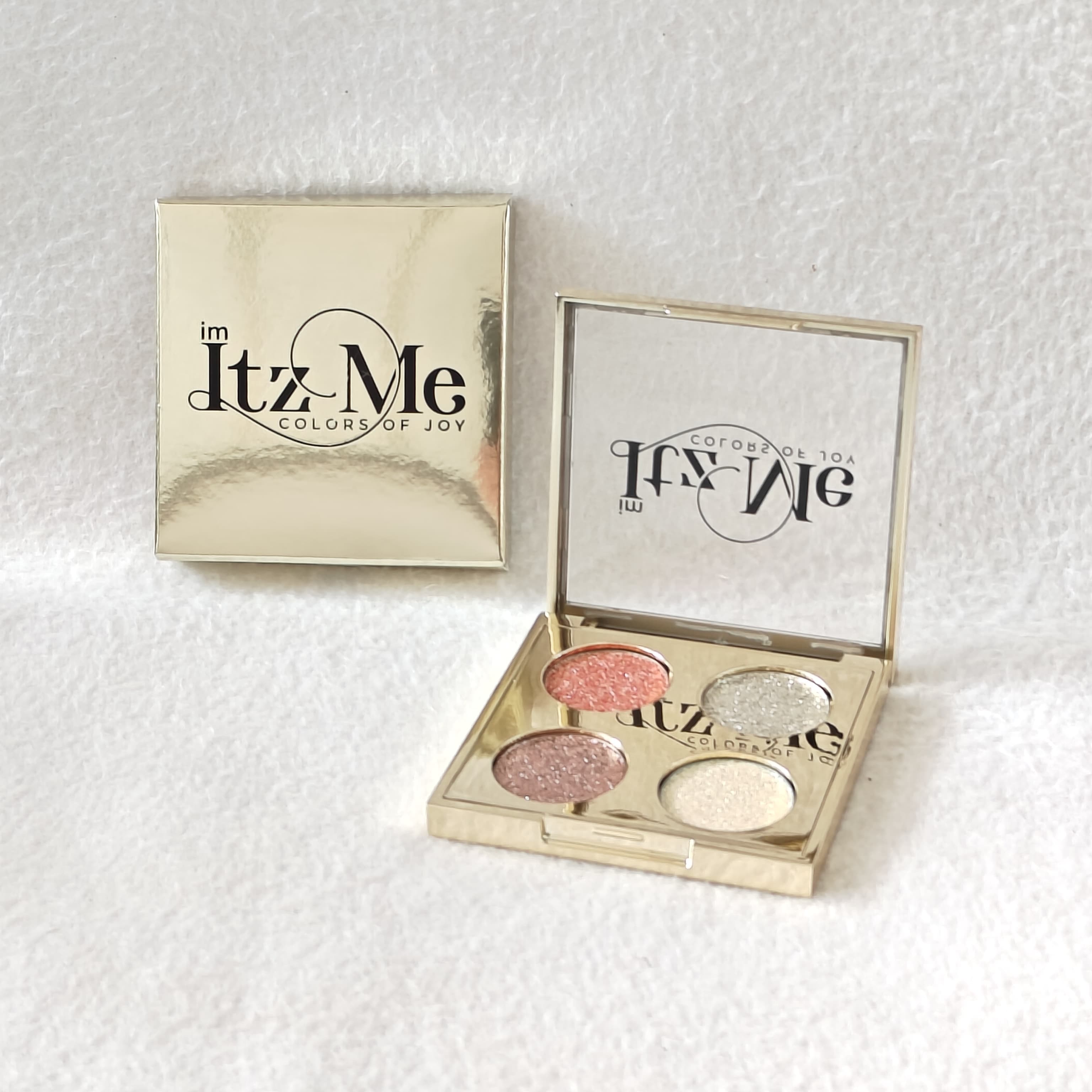 Itz Me Shimmer Palette Shade 02 with coral, rose gold, frosted silver, and champagne glitter tones in gold case Main image